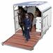 Box pour transport aérien, monté avec un cavalier et chargé avec trois chevaux.